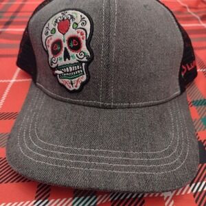Grey and black embroidered skull trucker hat